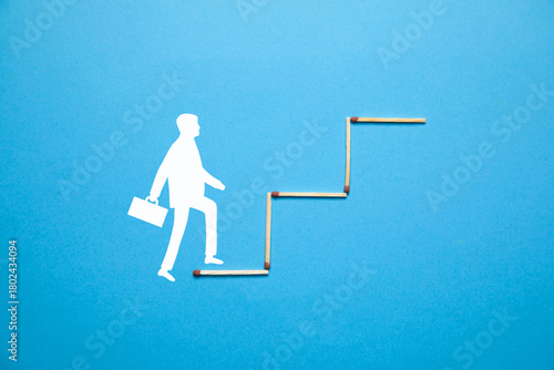 Businessman climbing success stairs. Personal development and career