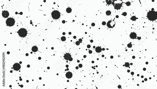 A white background speckled with black ink splatters of various sizes and shapes, creating a textured pattern
