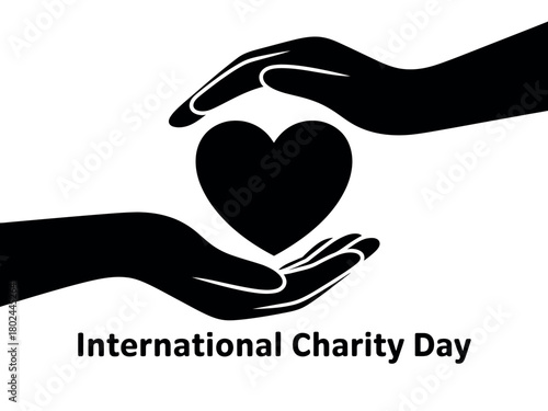 Two hands cradle a black heart symbolizing International Charity Day.