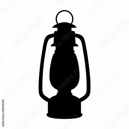 Vintage black silhouette of an antique kerosene lantern for camping or hiking