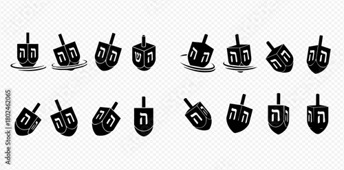 A collection of dreidels, traditional spinning tops used during the Jewish holiday of Hanukkah, in various orientations.