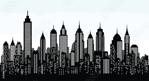 Black silhouette of a city skyline with numerous skyscrapers and illuminated windows at night.