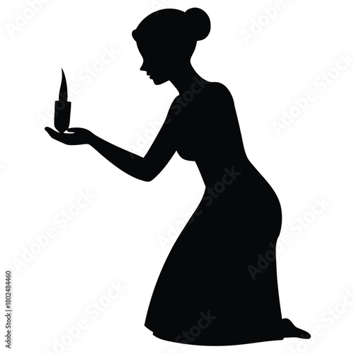 Kneeling Woman Silhouette Holding Candle for Spiritual or Commemorative Moment