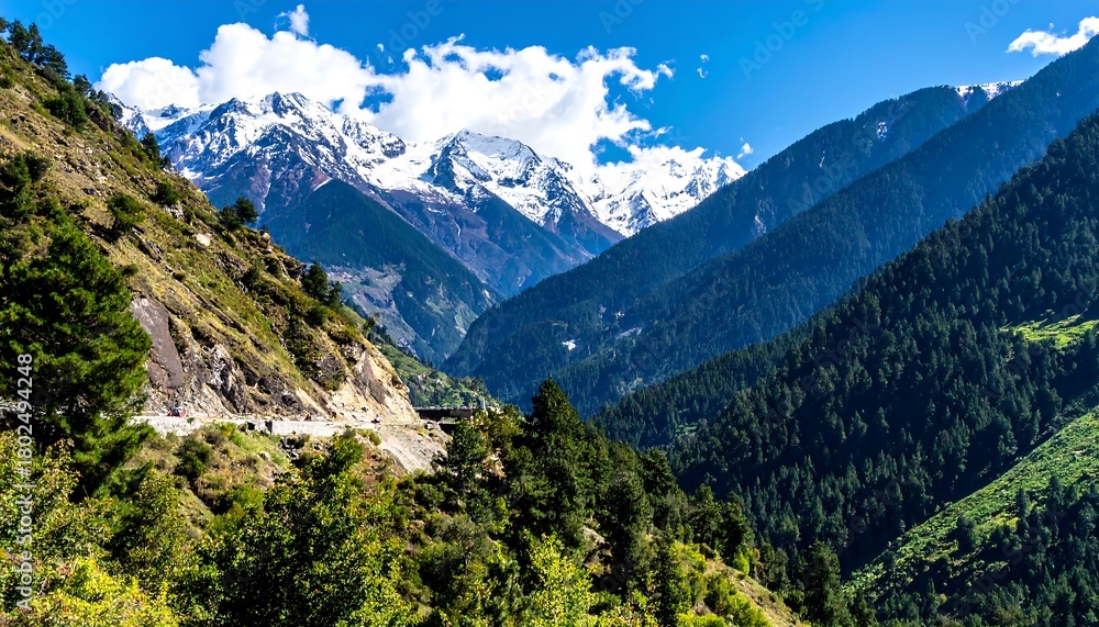 Obraz premium Serene Mountain Valley Landscape with Snow-Capped Peaks and Lush Greenery.