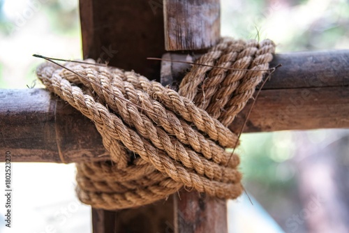 knotted rope on a wooden pole in close up