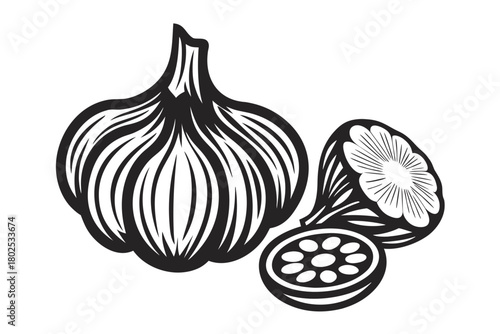 Black and white garlic bulb with sectioned clove illustrates fresh kitchen ingredients simply
