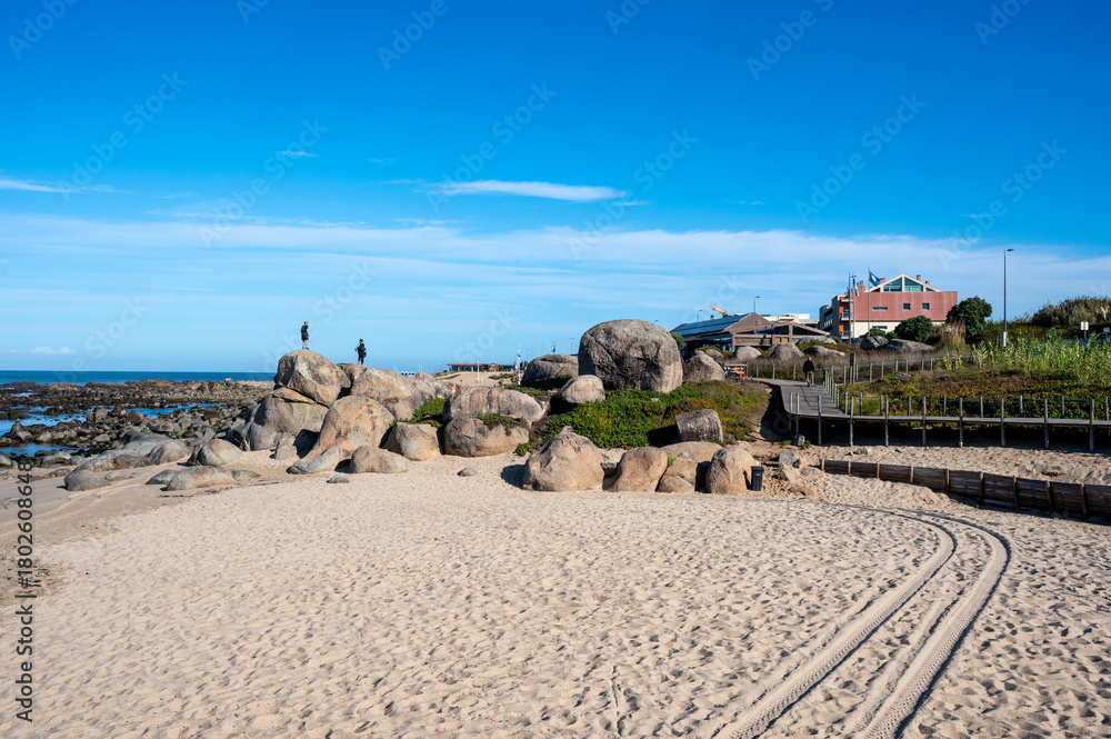 Obraz premium Praia de Canide, Canide Beach, on northern coast of Portugal in Vila Nova de Gaia under dramatic autumn cloudscape.