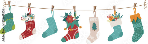 Christmas socks and stockings hanging on a rope with clothespins. Perfect for the festive Christmas season, as well as fall and winter merchandise.