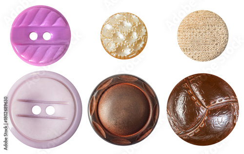 Isolated photo of various colored vintage plastic cloth buttons on white background.