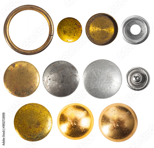 Isolated photo of various steel silver and copper decorative cloth buttons or rivets on white background.