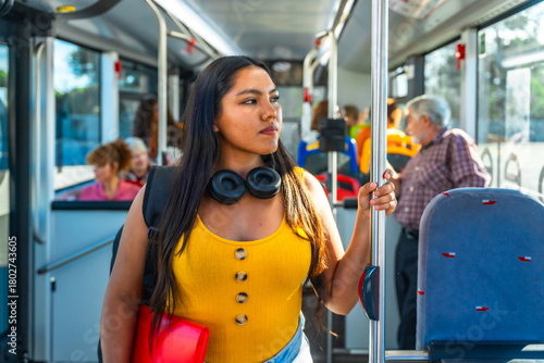 Young woman commuting on a bus for daily public transport