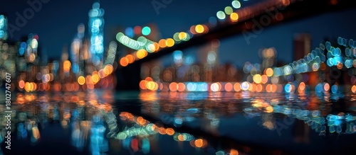 Blurred Cityscape at Night with Reflections on Water.