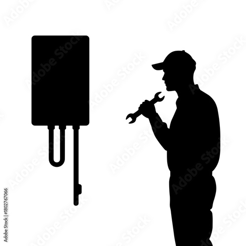 Silhouette of technician holding wrench near wall-mounted water heater, plumbing maintenance and equipment installation