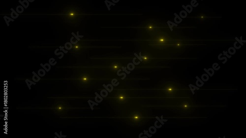 Yellow glowing light streaks moving horizontally across a dark black background with bokeh effects abstract