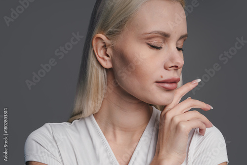 Obraz na plátně relaxed female in peaceful posture, calm female model with contemplative stance