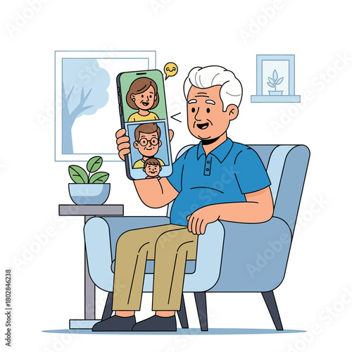 Happy elderly man video calling his family on a smartphone from his living room armchair.