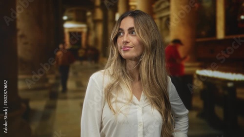Wallpaper Mural Woman bare arms stands with slight smile gazing sideways in historic catholic church interior; serenity faith devotion spirituality. Torontodigital.ca