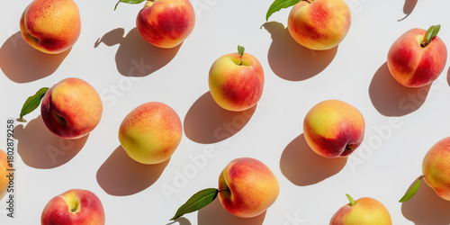 Freshly harvested peaches arranged on a bright surface in a vibrant display of colors
