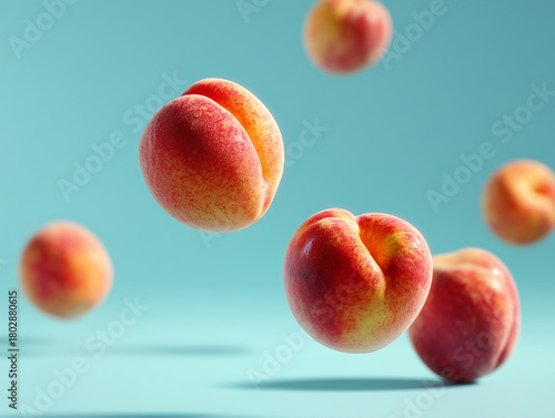 Floating peaches against a blue background create a vibrant and playful atmosphere in the fruit display