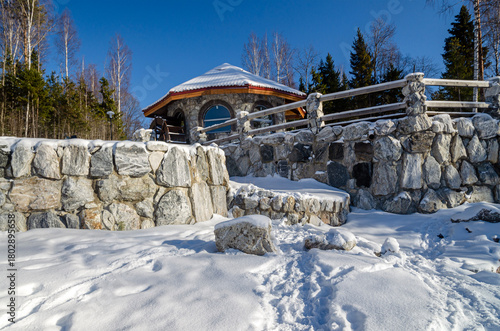 Winter landscape with pavilion