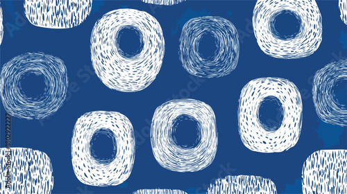 Abstrakcyjny wzór w kolorze indygo z ręcznie rysowanymi, geometrycznymi kształtami przypominającymi obwarzanki.