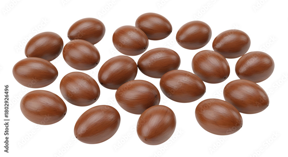 Fototapeta premium A scattered collection of brown shea nuts with smooth surfaces and subtle highlights isolated on a transparent background