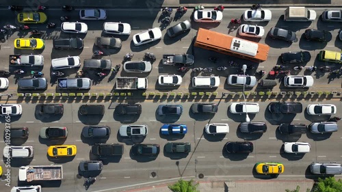 Aerial view of massive traffic jam in Bangkok, Thailand. Packed lanes of cars, buses, and motorbikes showing daily rush hour and urban life in Asia.