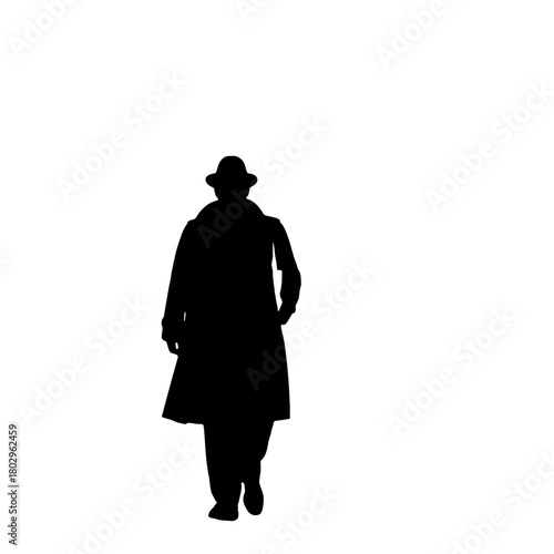 A silhouette of a person wearing a hat and a long coat walking forward on a white background space present