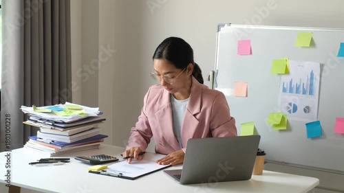 Businesswoman, office worker stressed out from laptop use, overwork, and accounting document errors. Office syndrome concept.