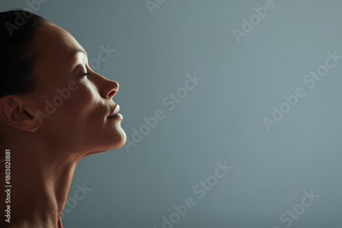 large perfectly polished mirror lies on ground reflecting expansive sky filled with soft clouds