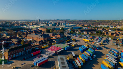 Aerial panorama showing logistics yard and distant city