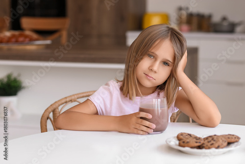 Cute little girl with glass...