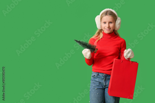 Cute girl with shopping bag...