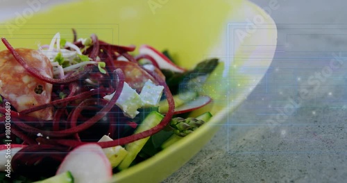 Camera racking focus, shifting, revealing yellow-green bowl, showing salad, overlay emerging right