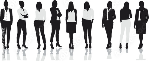 Diverse group of women in business attire standing in silhouette with reflections
