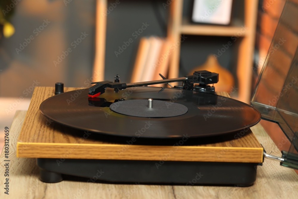 Obraz premium Modern turntable with vinyl record at home, closeup