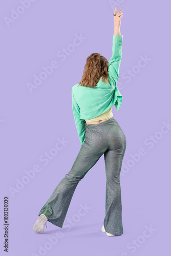 Cool young woman dancing on...
