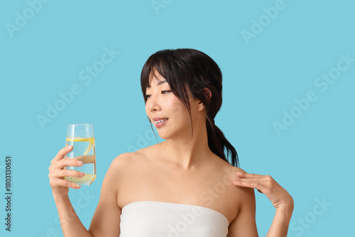 Young Asian woman with citr...