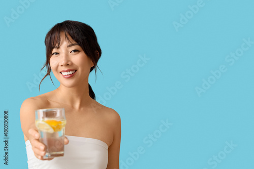 Young Asian woman with citr...