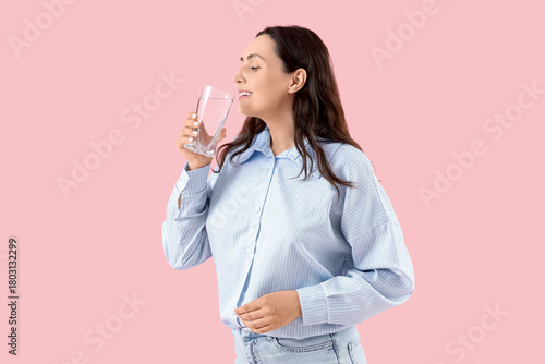 Young woman drinking water ...