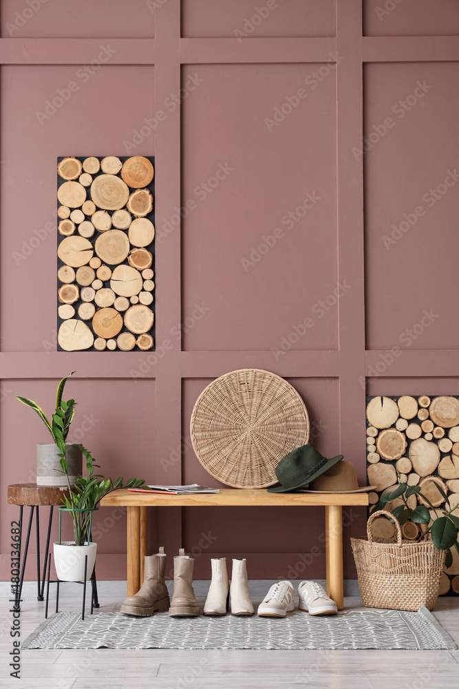 Obraz premium Interior of hallway with women's shoes, wooden bench and plants
