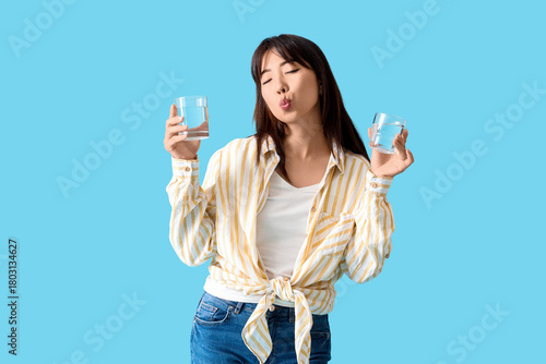 Young Asian woman with glas...