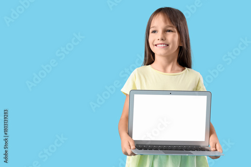 Cute little schoolgirl with...