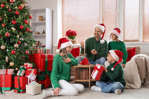 Happy family in Santa hats ...