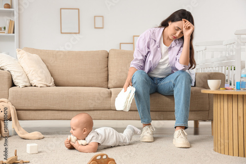 Young mother with diapers a...