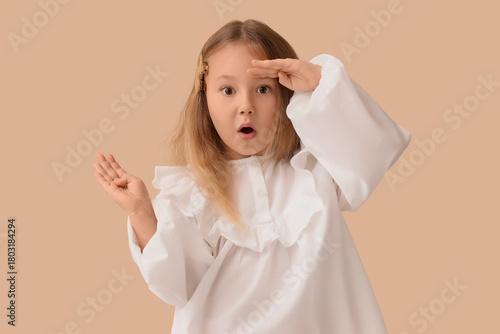 Cute little girl looking fa...