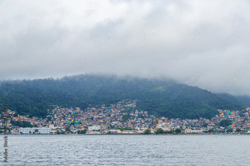 Fototapeta premium Mountains with favelas houses tropical nature Angra dos Reis Brazil.