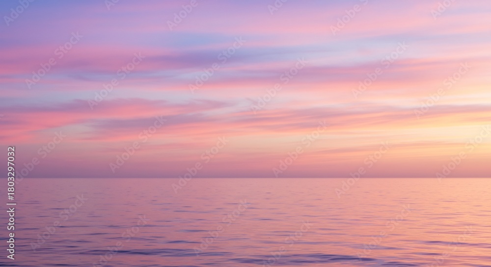 Obraz premium 朝焼けに染まる広大な海と空 美しいピンクと紫のグラデーションが静かに輝く幻想的な光景. AI Generated