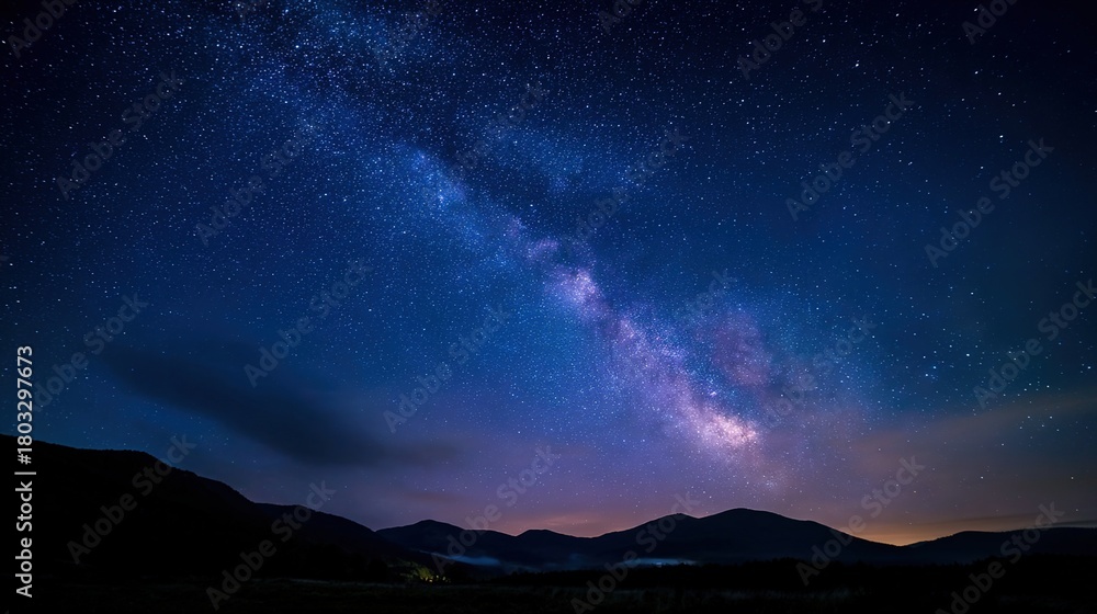 Fototapeta premium planetarium. Night sky filled with stars and the Milky Way, glowing in deep blue with long exposure effect. travel magazines, destination branding, designed for travel destination branding.
