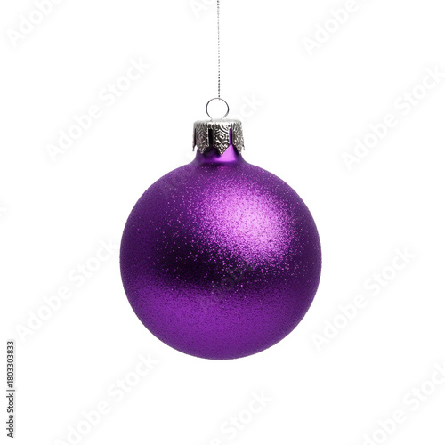 A single purple Christmas ornament hanging from a string against a white background.